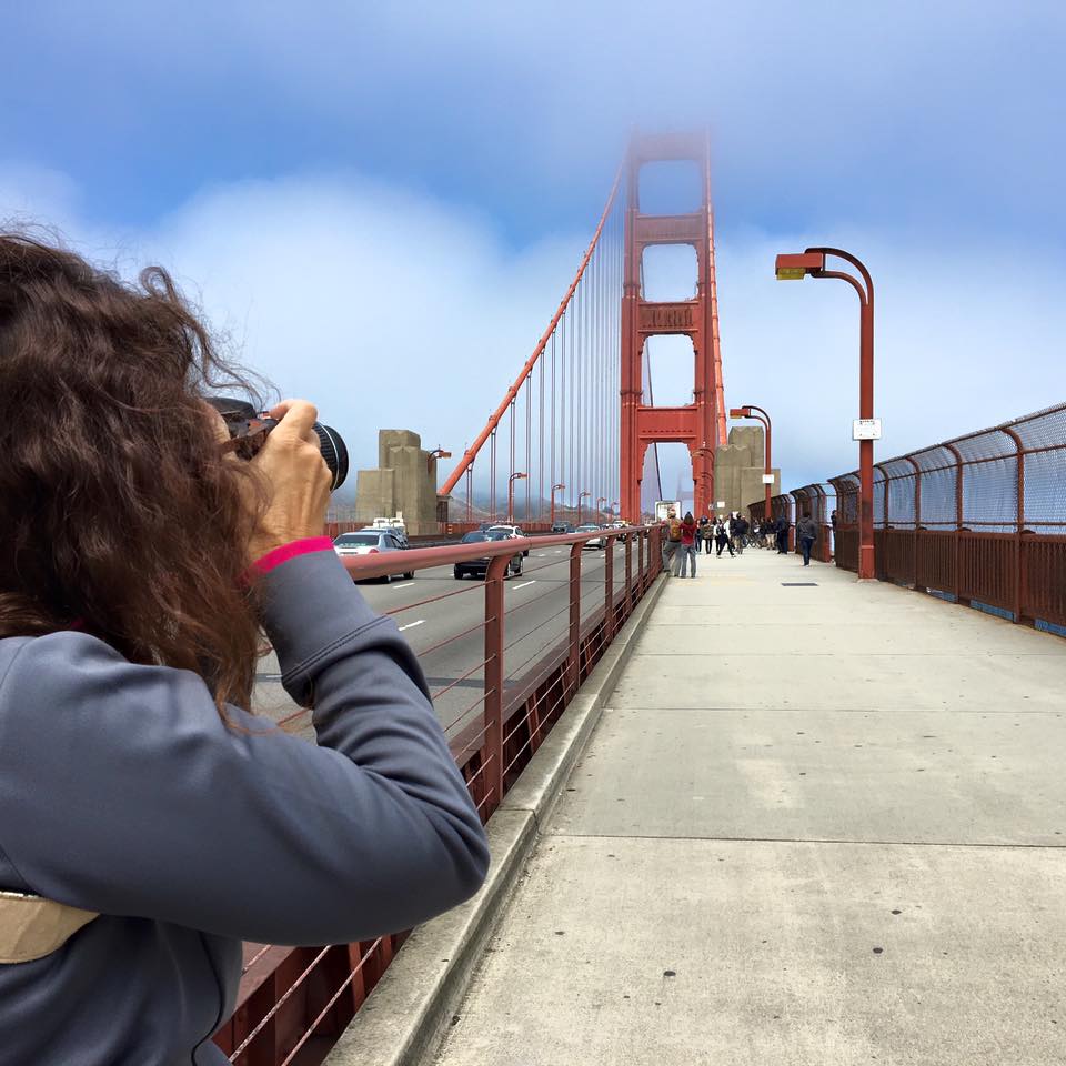 Dee taking a photo of the Golden Gate Bridge in San Francisco