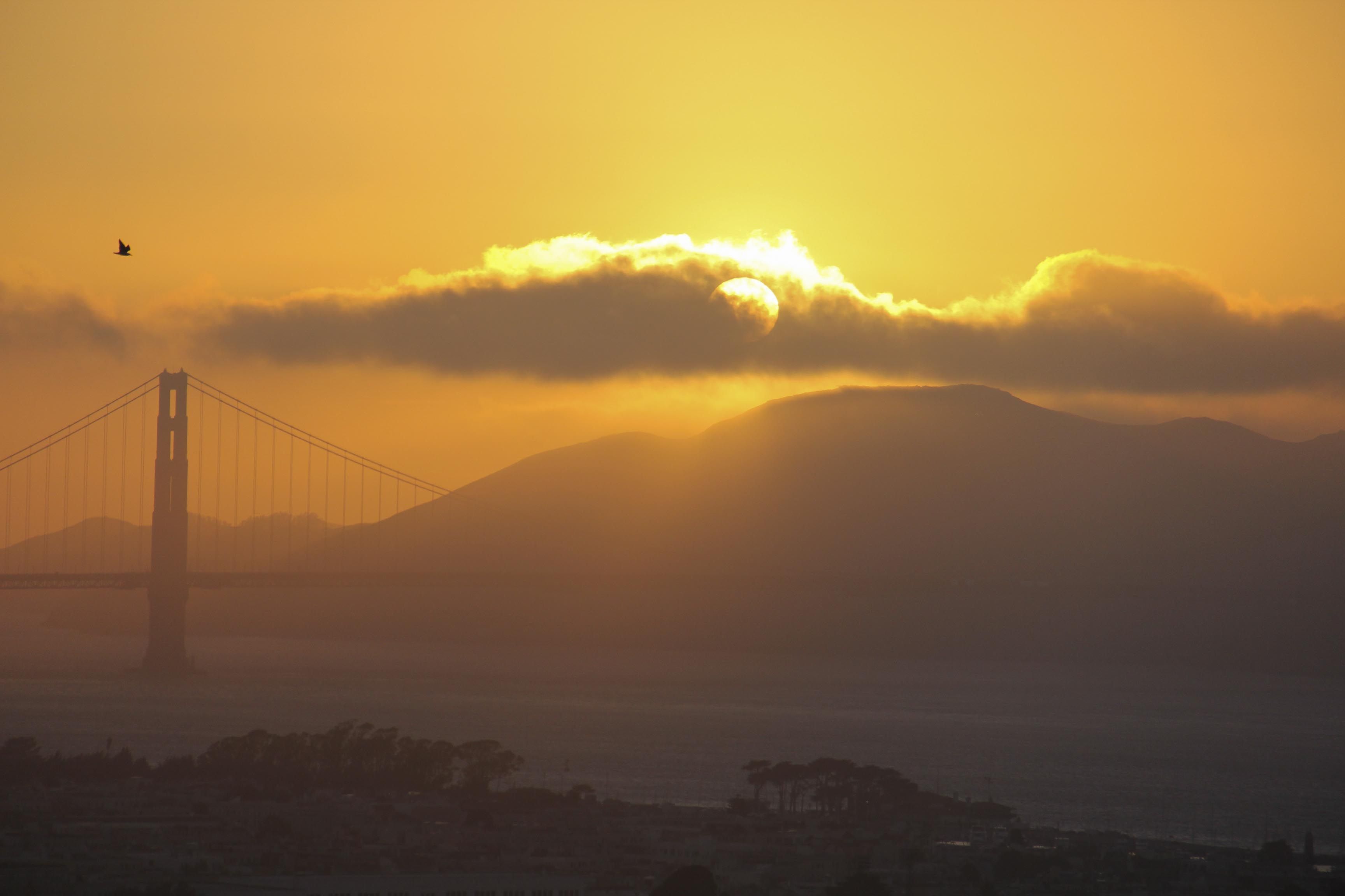 A view of the sunset over the Golden Gate Bridge.