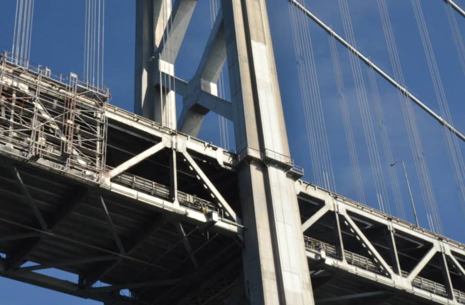 Looking up at the whiteness of the bay bridge.